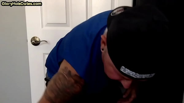 Tattooed gloryhole amateur DILF sucks and wanks cock