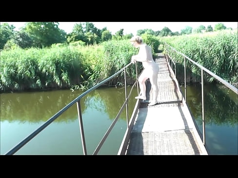 Summer nostalgia. dressed in sun. sexy naked woman milf walks on hanging bridge of river. nudists. naturists. nude beach. music erotic clip.    html5player.setencodedidvideo('upbkecbf57f