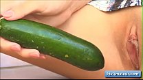 Sexy brunette amateur Nina with amazing big natural boobs fucks her shaved cunt with long cucumber for a massive orgasm