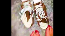 Girl shows her sweaty, stinky Converse sneaker shoes, the insoles are very sweaty and very stinky to wear from barefoot.