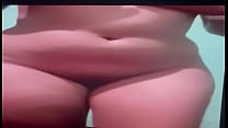 Latina enjoying herself in front of the camera
