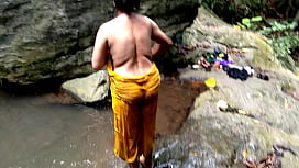 Dirty Auntie Gets Wet in Jungle Pond While Public Watching