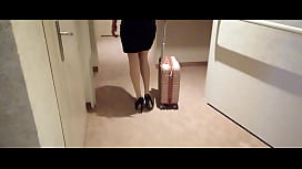 MILF in Stockings and Heels Struts Through Hotel Corridors