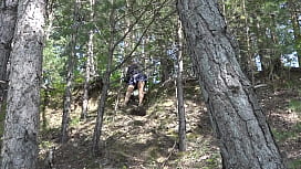 Under a skirt without panties. Hairy pussy and big ass in a short dress climbs mountains in nature.