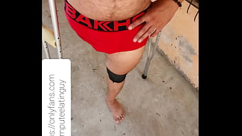 Amputee guy walking in underwear.