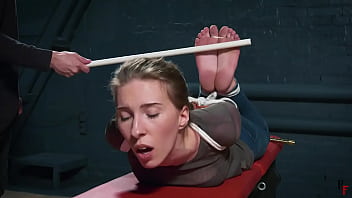Alena is tightly hogtied and foot caned
