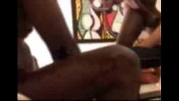 white bitch chained to a breeding bench and blackbred white bitch chained to a breeding bench and blackbred