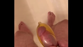 Filling a condom with then cum...