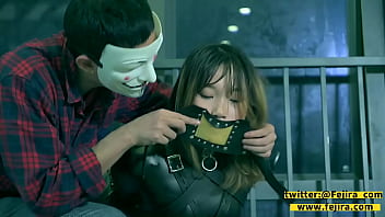 The girl in leather who was locked with a mask...