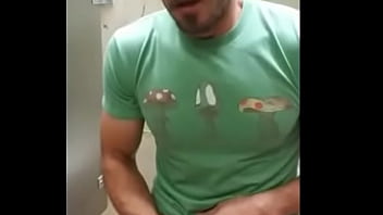 Hot dude jacks off in busy airport bathroom stall