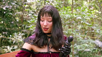 Little Red Riding Hood walking alone in the forest