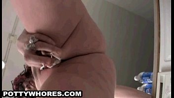 Goth babe sucks her tampons and takes a pee