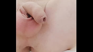 twink plays with his piss