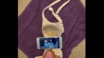 Busting a phat nut on a phone and bra