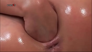 Oily blonde hooker fisting herself hard on a chair
