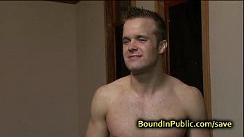 Bound gay face covered in cum in public