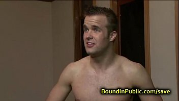 Bound gay face covered in cum in public