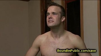 Bound gay face covered in cum in public