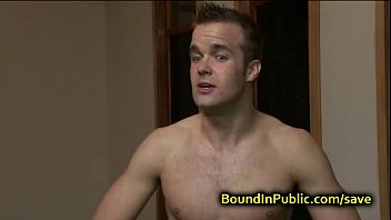 Bound gay face covered in cum in public