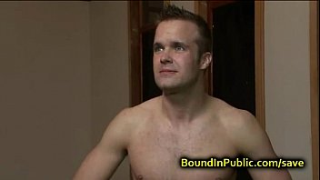 Bound gay face covered in cum in public