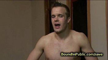 Bound gay face covered in cum in public