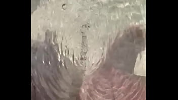 Pissing in puddle on beach