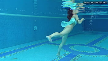 Sexiest petite teen Lizi Vogue swims naked in the pool