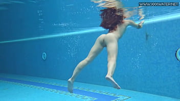 Sexiest petite teen Lizi Vogue swims naked in the pool
