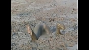 Girl Diving Headfirst Into Deep Mud