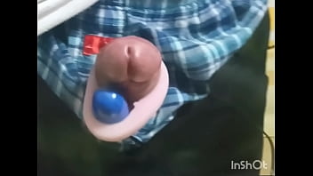 Rotor masturbation with a penis sticking out of the pants