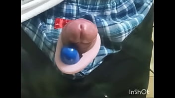 Rotor masturbation with a penis sticking out of the pants