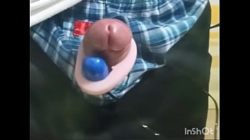 Rotor masturbation with a penis sticking out of the pants