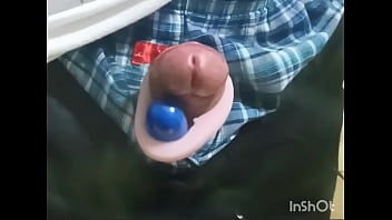 Rotor masturbation with a penis sticking out of the pants
