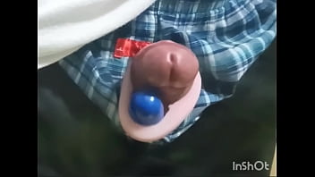 Rotor masturbation with a penis sticking out of the pants