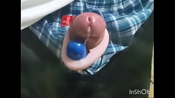 Rotor masturbation with a penis sticking out of the pants