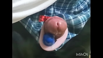 Rotor masturbation with a penis sticking out of the pants