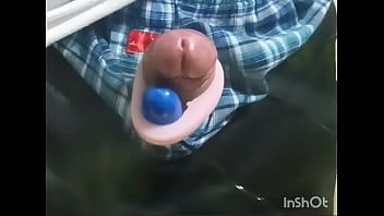 Rotor masturbation with a penis sticking out of the pants
