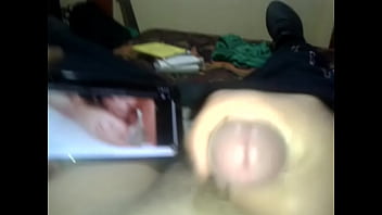 Guy cumming while watching anal threesome