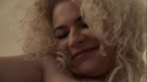 Curly Blonde Shows Off Her Pretty Pussy in the Kitchen Thumbnail