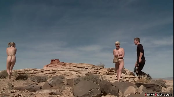 Busty blondes hogied in a desert