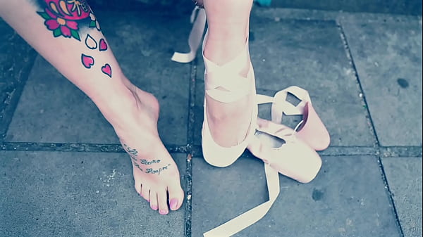 Ballerina Wearing Ballet Shoes and Walking Down The Street