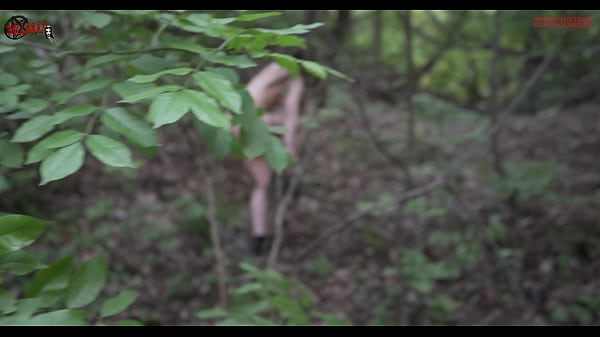 Mel walks naked in the wood