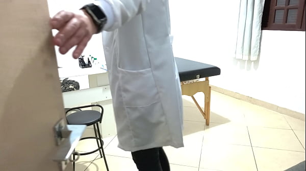 Proctologist performs anal exam on constipated patient.