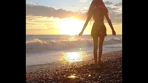 Sunset girl at the sea beach Thumbnail