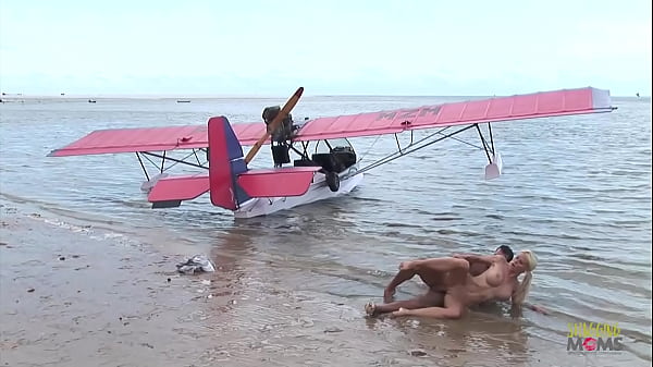 Passionate fucking on the beach with a stunning blonde with big tits