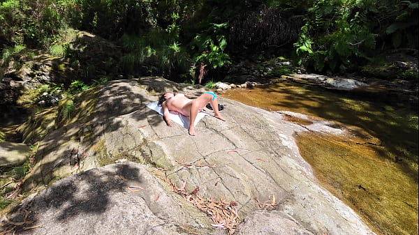An impudent Voyeur Fingered a Naked Milf on a Nudist Beach in the Forest