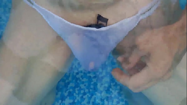 Slut in white panties having fun in the pool