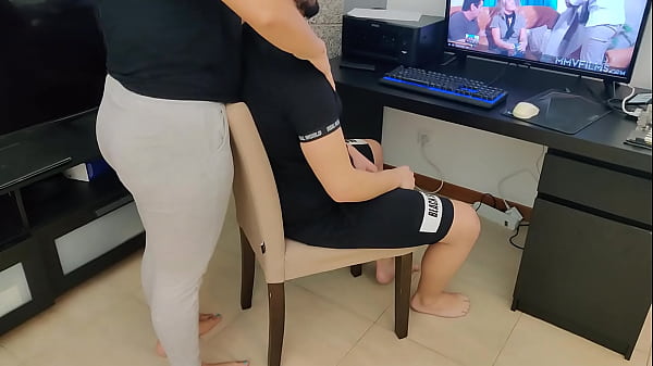 mature gives her stepson a handjob while watching porn