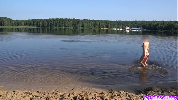 Naked girl goes skinny dipping in public beach