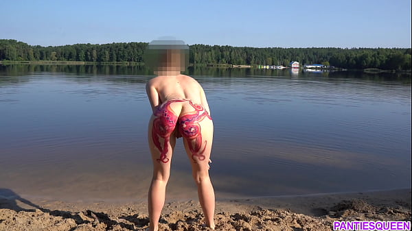 Naked girl goes skinny dipping in public beach